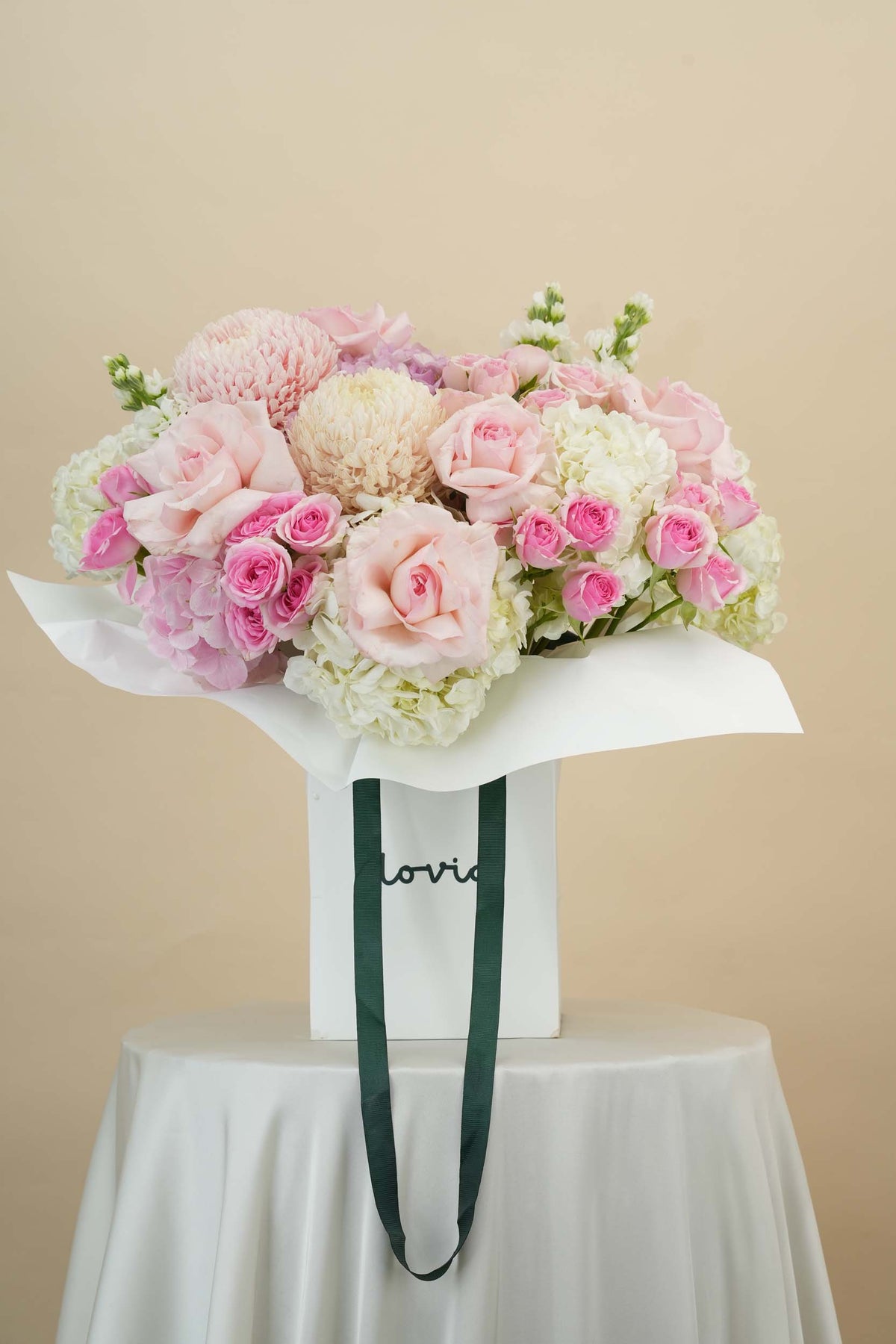 Blush Pink flower bag close-up of pink roses and peach chrysanthemum