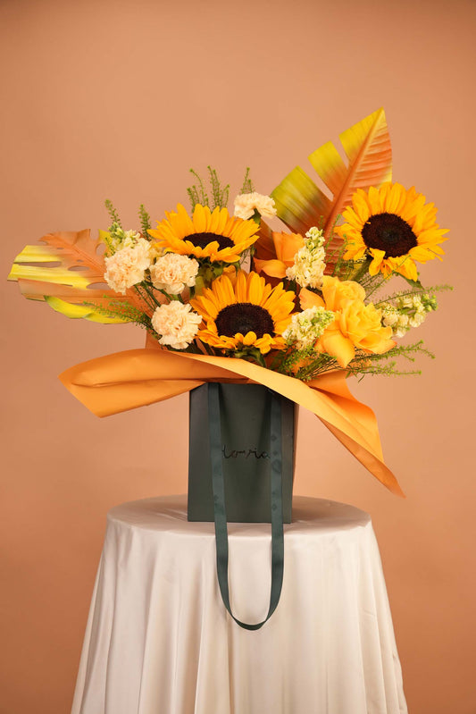 Golden Hour - Sunflower & Tropical Leaf Bag Arrangement